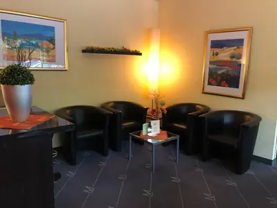 Ein Sitzbereich in der Unterkunft City Hotel Essen