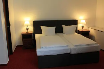 Ein Bett oder Betten in einem Zimmer der Unterkunft City Hotel Essen