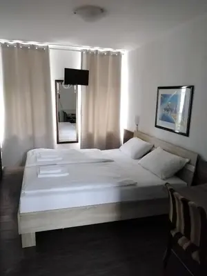 Ein Bett oder Betten in einem Zimmer der Unterkunft Hotel Berliner Hof