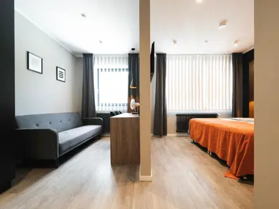 Ein Bett oder Betten in einem Zimmer der Unterkunft JustStay Solingen Hotel & Apartments