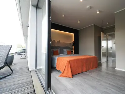 Ein Bett oder Betten in einem Zimmer der Unterkunft JustStay Solingen Hotel & Apartments
