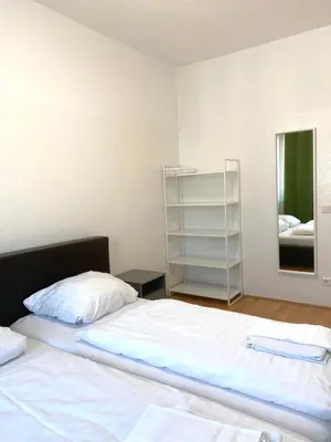 Ein Bett oder Betten in einem Zimmer der Unterkunft Graf-Adolflux