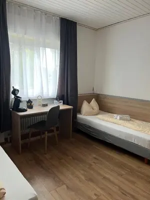 Ein Bett oder Betten in einem Zimmer der Unterkunft Hubertus-Hof