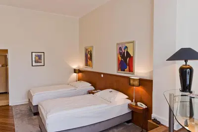 Ein Bett oder Betten in einem Zimmer der Unterkunft Hotel Friederike