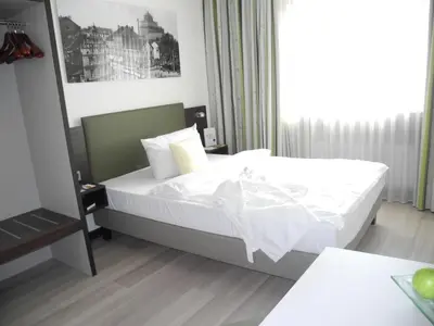 Ein Bett oder Betten in einem Zimmer der Unterkunft Ringhotel Drees