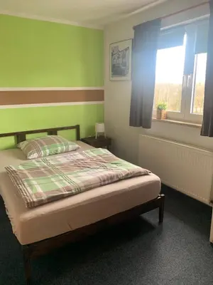 Ein Bett oder Betten in einem Zimmer der Unterkunft Hotel Zur Schleuse (Garni)