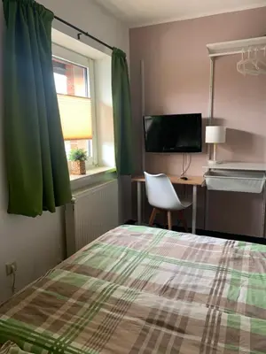 Ein Bett oder Betten in einem Zimmer der Unterkunft Hotel Zur Schleuse (Garni)