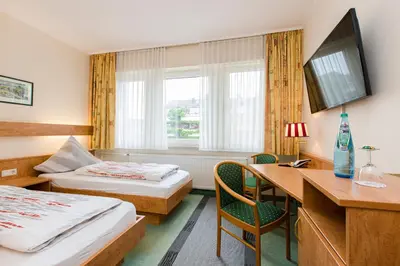 Ein Bett oder Betten in einem Zimmer der Unterkunft Hotel Am Düsseldorfer Platz