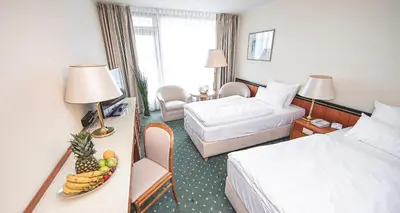 Ein Bett oder Betten in einem Zimmer der Unterkunft PLAZA Hotel Gelsenkirchen