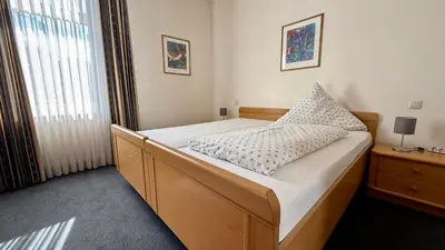 Ein Bett oder Betten in einem Zimmer der Unterkunft Hotel am Schloss Borbeck