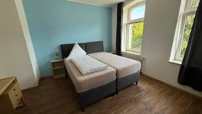 Ein Bett oder Betten in einem Zimmer der Unterkunft Hotel am Schloss Borbeck