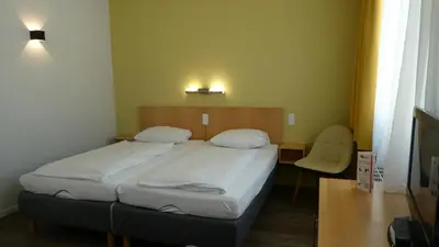 Ein Bett oder Betten in einem Zimmer der Unterkunft CVJM Düsseldorf Hotel & Tagung