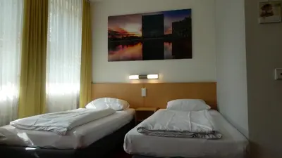 Ein Bett oder Betten in einem Zimmer der Unterkunft CVJM Düsseldorf Hotel & Tagung