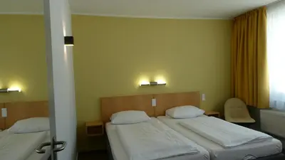 Ein Bett oder Betten in einem Zimmer der Unterkunft CVJM Düsseldorf Hotel & Tagung