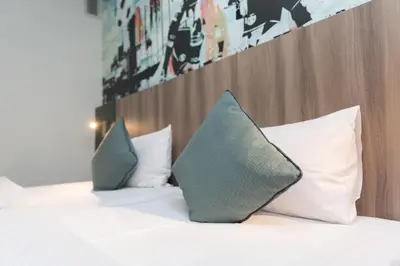 Ein Bett oder Betten in einem Zimmer der Unterkunft Good Morning Gelsenkirchen City