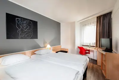 Ein Bett oder Betten in einem Zimmer der Unterkunft Good Morning Gelsenkirchen City