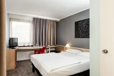 Ein Bett oder Betten in einem Zimmer der Unterkunft Good Morning Gelsenkirchen City