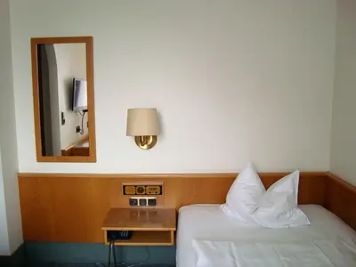Ein Bett oder Betten in einem Zimmer der Unterkunft Hotel-Restaurant Handelshof