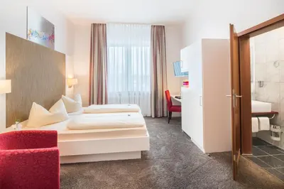 Ein Bett oder Betten in einem Zimmer der Unterkunft Hotel Monopol