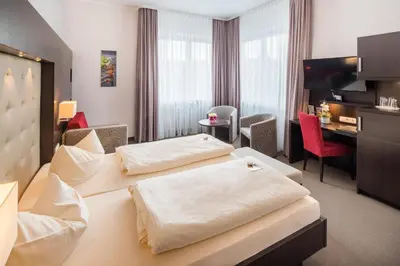 Ein Bett oder Betten in einem Zimmer der Unterkunft Hotel Monopol