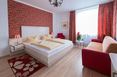 Ein Bett oder Betten in einem Zimmer der Unterkunft Hotel Monopol