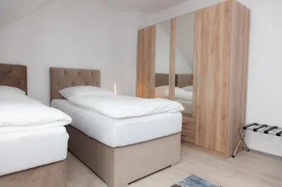 Ein Bett oder Betten in einem Zimmer der Unterkunft T&K Apartments near Messe Fair Trade Düsseldorf und Airport 3A
