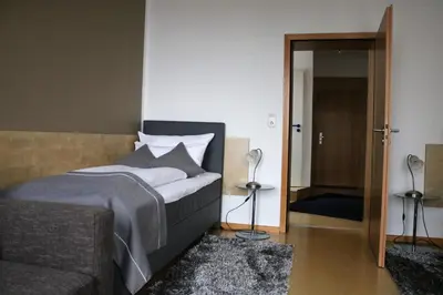 Ein Bett oder Betten in einem Zimmer der Unterkunft Hotel Schmerkötter