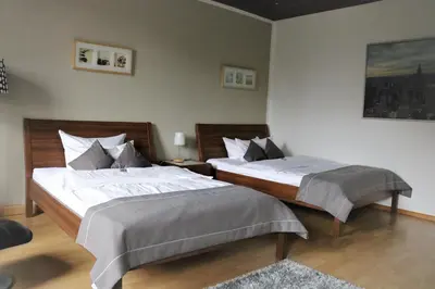 Ein Bett oder Betten in einem Zimmer der Unterkunft Hotel Schmerkötter