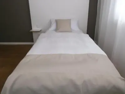 Ein Bett oder Betten in einem Zimmer der Unterkunft ART Hotel Ufer