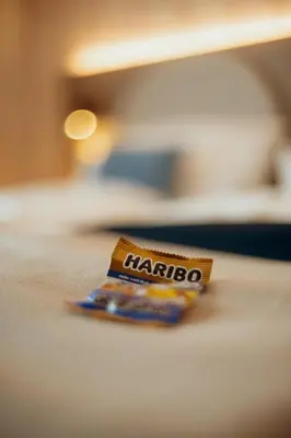 Ein Bett oder Betten in einem Zimmer der Unterkunft guestified BARBAROSSA Hotel