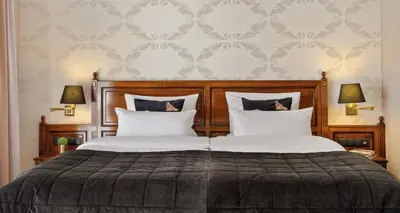 Ein Bett oder Betten in einem Zimmer der Unterkunft Parkhotel Engelsburg - 4 Sterne Superior