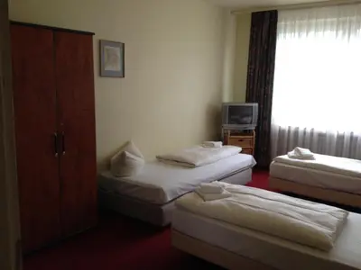 Ein Bett oder Betten in einem Zimmer der Unterkunft Domo Hotel Mondial