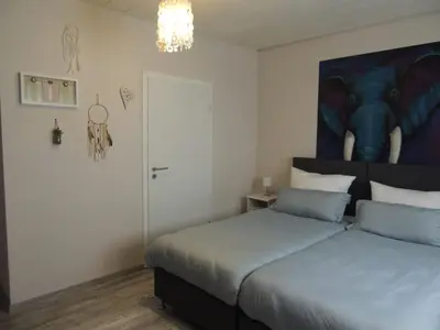 Ein Bett oder Betten in einem Zimmer der Unterkunft Gästehaus Holiday