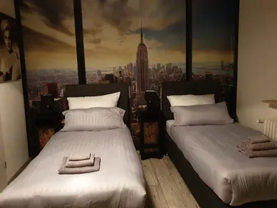 Ein Bett oder Betten in einem Zimmer der Unterkunft Gästehaus Holiday