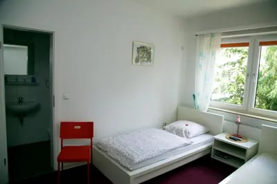 Ein Bett oder Betten in einem Zimmer der Unterkunft Hotel Hoffmann