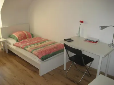 Ein Bett oder Betten in einem Zimmer der Unterkunft Hotel Hoffmann