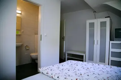 Ein Bett oder Betten in einem Zimmer der Unterkunft Hotel Hoffmann