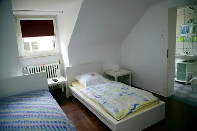 Ein Bett oder Betten in einem Zimmer der Unterkunft Hotel Hoffmann