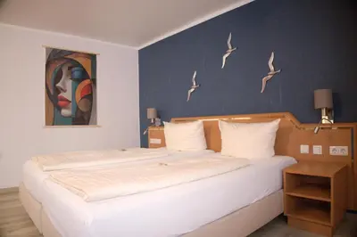 Ein Bett oder Betten in einem Zimmer der Unterkunft Hotel Grütering