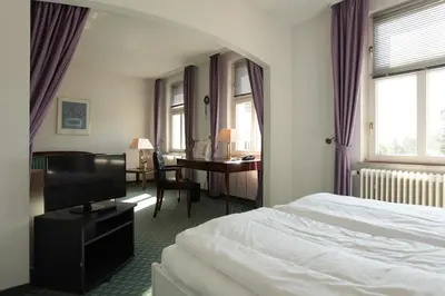 Ein Bett oder Betten in einem Zimmer der Unterkunft Hotel Haus Duden