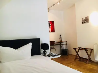 Ein Bett oder Betten in einem Zimmer der Unterkunft Dieckmann's Hotel