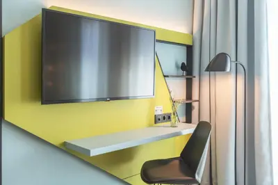 TV/Unterhaltungsangebot in der Unterkunft Holiday Inn - the niu, Seven Dusseldorf Ost by IHG