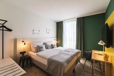 Ein Bett oder Betten in einem Zimmer der Unterkunft Holiday Inn - the niu Tab Dusseldorf Main Station by IHG
