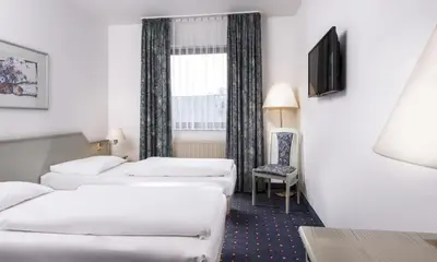 Ein Bett oder Betten in einem Zimmer der Unterkunft Wyndham Garden Duesseldorf Mettmann