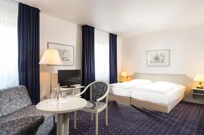 Ein Bett oder Betten in einem Zimmer der Unterkunft Wyndham Garden Duesseldorf Mettmann