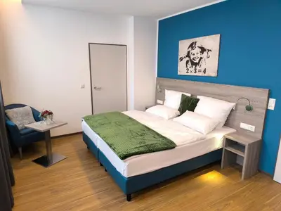 Ein Bett oder Betten in einem Zimmer der Unterkunft New Work Hotel Essen