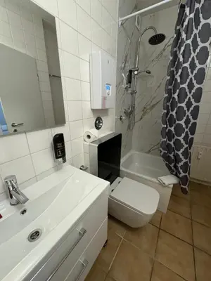 Ein Badezimmer in der Unterkunft Hotel Drei Kronen