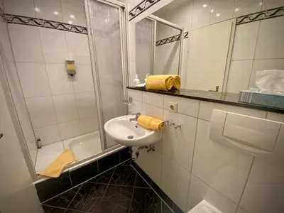 Ein Badezimmer in der Unterkunft Hotel Ambiente et Art