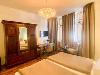 Ein Bett oder Betten in einem Zimmer der Unterkunft Hotel Ambiente et Art