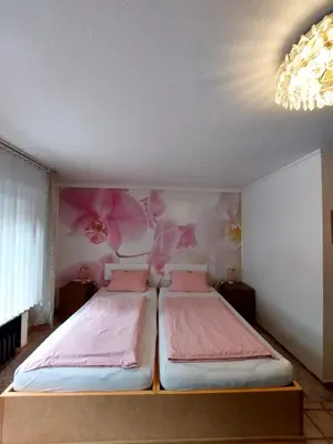 Ein Bett oder Betten in einem Zimmer der Unterkunft Am Hallenbad Hotel garni